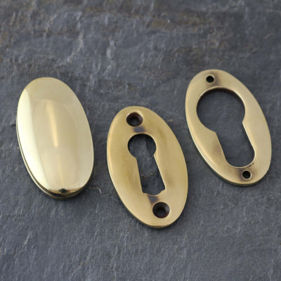 Aged Brass Period Oval Escutcheons